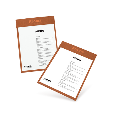 Two clipboards with brown edges and white menu sheets, one with 'COCKTAILS' and the other with 'MENU' written at the top, both lying at an angle.