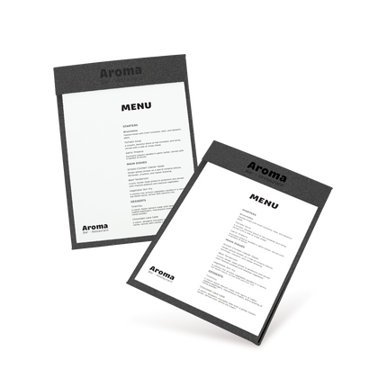 Two clipboards with black edges and white menu sheets, one with 'COCKTAILS' and the other with 'MENU' written at the top, both lying at an angle.