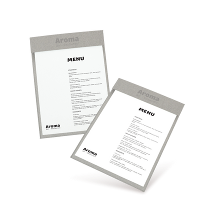 Two clipboards with grey edges and white menu sheets, one with 'COCKTAILS' and the other with 'MENU' written at the top, both lying at an angle.